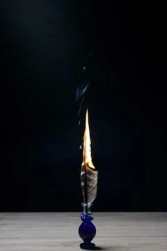 Burning writing feather Stock Photos