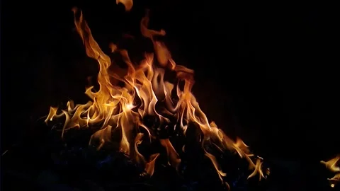 Burning yellow flames in the dark Stock Footage 143049064