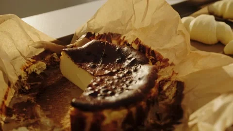 Burnt Basque cheesecake close-up. Spanish dessert, display in a bakery.  Stock Footage 267015712