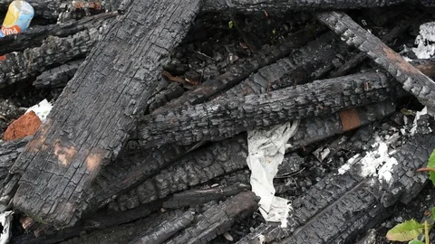 Burnt black logs left over from the fire Stock Footage 119018245
