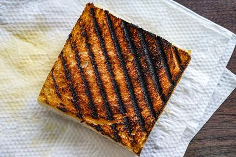 Burnt bread from sandwich maker. Stock Photos