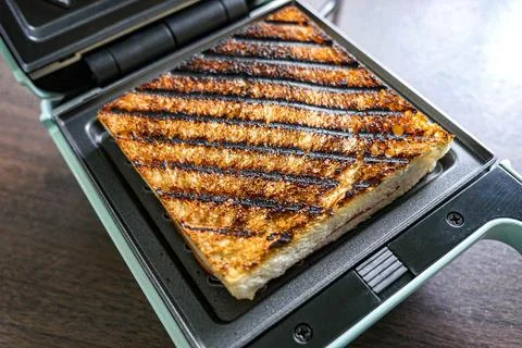 Burnt bread from sandwich maker. Stock Photos