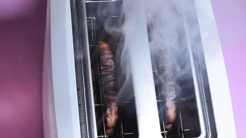 Burnt bread in the toaster close-up. making toast Stock Footage 124973185