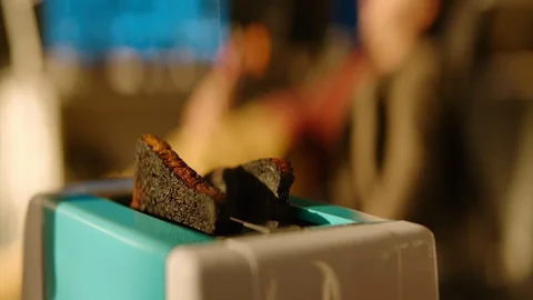 Burnt bread in a toaster. 動画素材 120732029