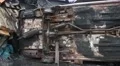 Burnt car lying on its side HD Footage