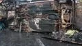 Burnt car lying on its side HD Footage