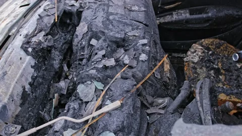 Burnt Car Wreck Interior with Melted Plastic Destroyed in Tragic Deadly Road Acc Stock Footage 310090644