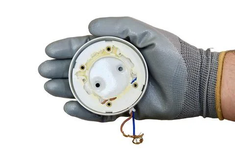 Burnt ceiling light bulb holder with broken plastic, isolated on a white back Stock Photos