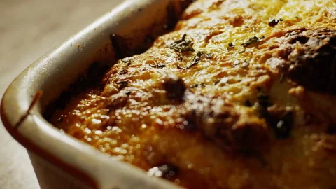 Burnt cheese lasagna plate, vegetarian and organic food background, Stock Footage