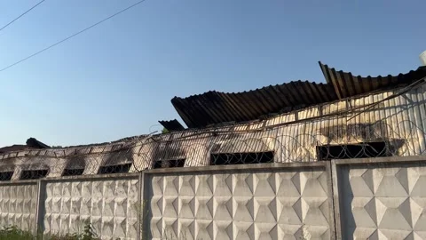 Burnt down industrial building after Russian shelling of Ukraine 스톡 동영상 205230740