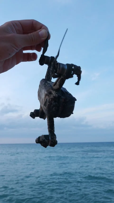 Burnt drone quadcopter in hand. 動画素材 277516358