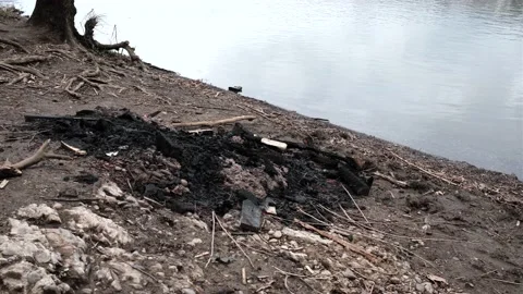 Burnt fire pit by Allegheny River Video stock 180651928