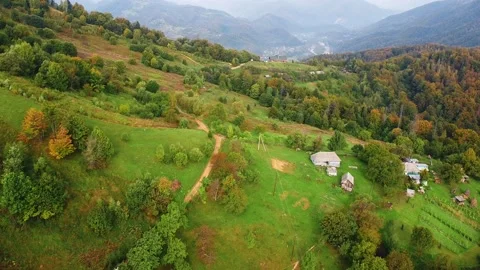 Burnt grass fields at Alps mountain village aerial. Nobody nature landscape Stock Footage 230997948