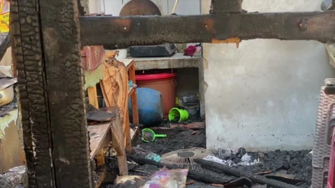 Burnt house interior after fire disaster with charred wooden beams Stock-Footage 341894130