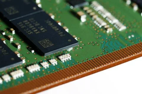 Burnt laptop RAM module with short circuit damage under the microchip. Stock Photos