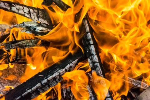 Burnt logs in flames Stock Photos