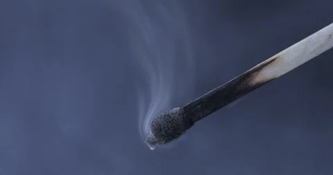 Burnt match on a black background Stock Footage 129968898