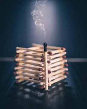 Burnt match with stack of matches Stock Photos