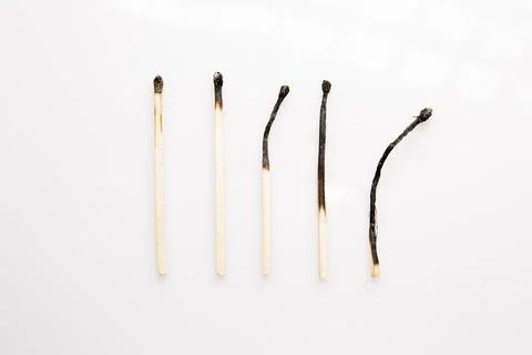 Burnt matches on white background Stock Photos