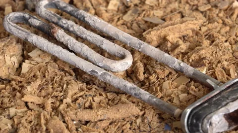 Burnt out Broken Electric Water Heater Heating Element from the washing machine Stock Footage
