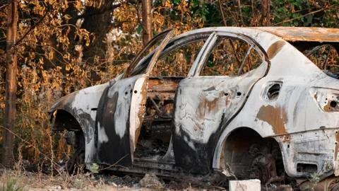 Burnt out car. Inside a burnt auto. The burned-out car interior. Stock Photos