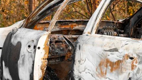 Burnt out car. Inside a burnt auto. The burned-out car interior. Stock Photos