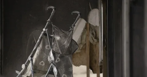 Burnt Out Home Interior Medium Close Up of Baby Stroller - Pan Left Stock Footage 89941905