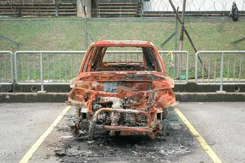 Burnt-out shell of an automobile after a blaze 写真素材