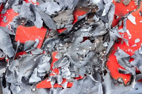 Burnt red paper texture with ash closeup for design Stock Photos