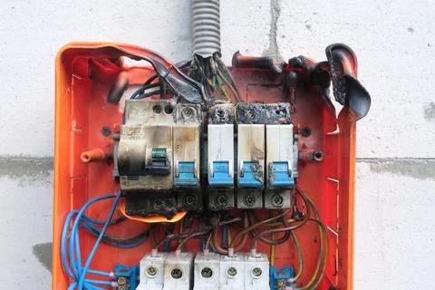 Burnt switchboard from overload or short circuit. Stock Photos