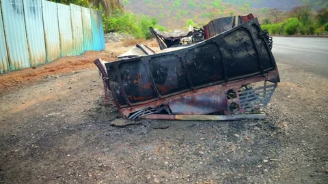 Burnt Vehicle Shell on Roadside Stock Footage 290114399