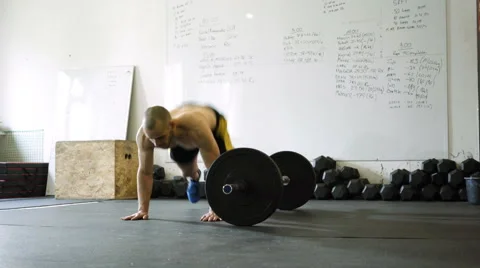 Burpee over the bar exercise - young athlete doing bodyweight workout at the Stock Footage 65279198