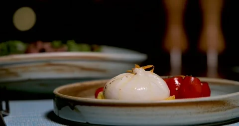 Burrata cheese with cherry tomatoes on ceramic plate, Italian Stock Footage 311999452