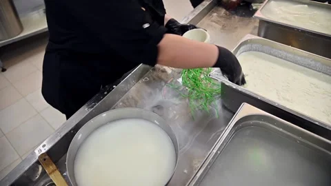 Burrata cheese production process with hands shaping curds in kitchen Stock Footage 337229283