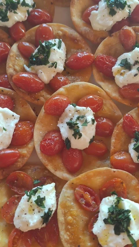 Burrata, cherry tomato and basil bruschetta. Stock Footage 303308216