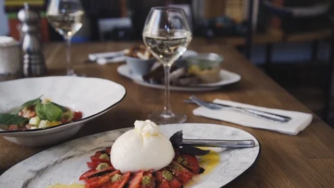 Burrata with tomato and basil. Stock Footage 112388868