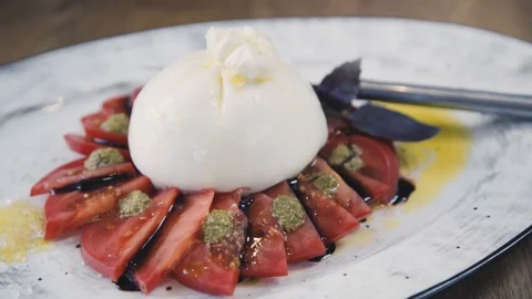 Burrata with tomato and basil. Stock Footage 112389673