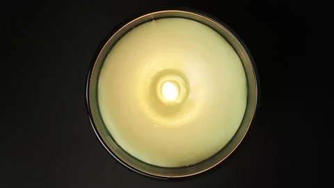 Burring aroma candle on black background top view. Candlelight close up Stock Footage 170498404