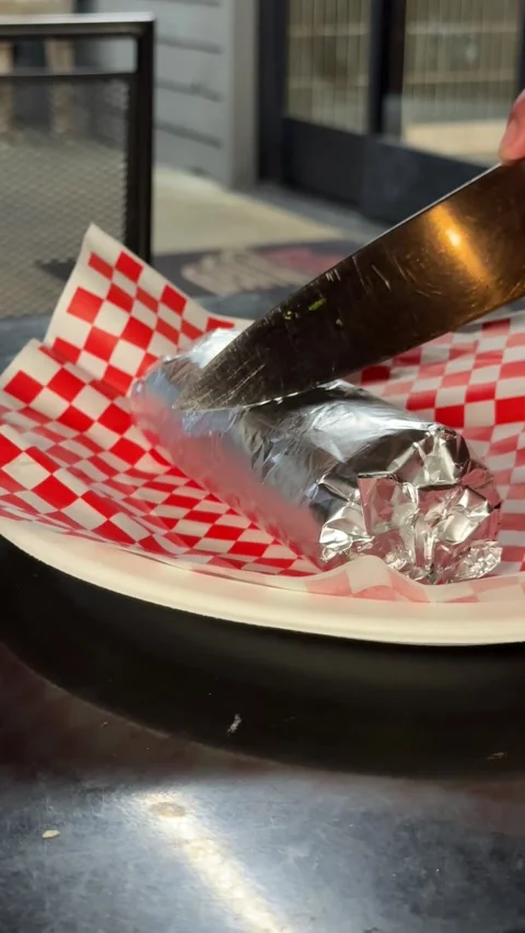 Burrito Being Sliced Before Serving Stock Footage 318749282