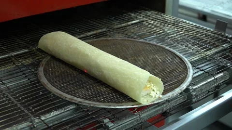 The burrito goes into the oven Stock Footage 187157601