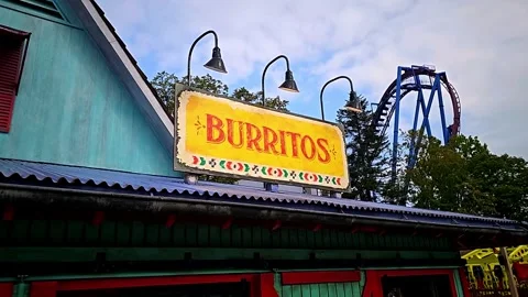 Burrito Sign with Roller Coaster in background in 4K! Stock Footage 250101526