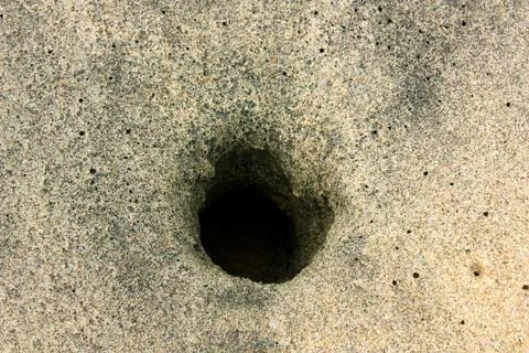 Burrow in the sand Stock Photos