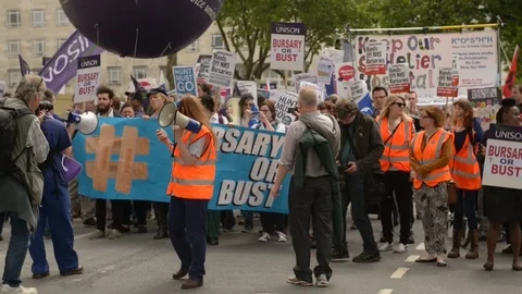 Bursary or Bust protest march by NHS medical students &amp; junior doctors/nurses. Stock Footage 71170153