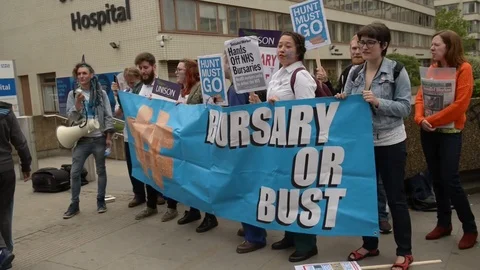 Bursary or Bust protest march by NHS medical students &amp; junior doctors/nurses. Stock Footage 71170608