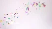 A Burst Of Multi Coloured Confetti On A White Background Stock Footage