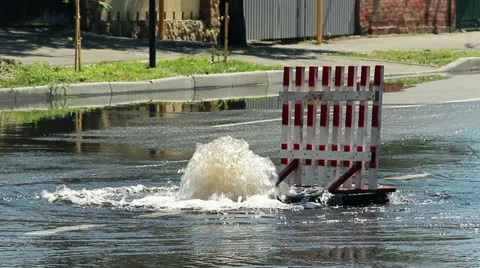 Burst pipe on the road Stock Footage 24869192