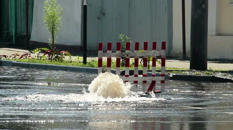 Burst pipe on the road Stock Footage 24876702
