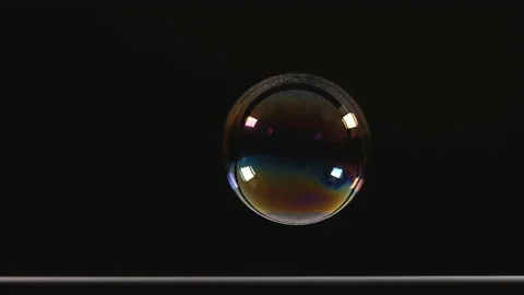 The bursting of a big soap bubble. slow motion Stock Footage 154449898