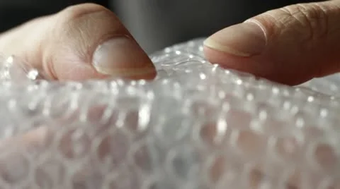 Bursting Bubble Wrap Stock Footage 22797290