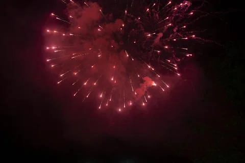 Bursting red firework Stock Photos